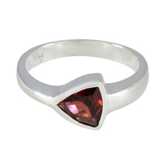 Riya geometric red solitaire ring with a triangular red gemstone set in a silver band
