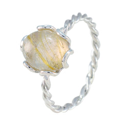 Yuki golden solitaire twist ring with a textured golden stone and twisted silver band