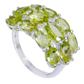 Camila green gemstone cocktail ring featuring multiple oval green gemstones set in silver band