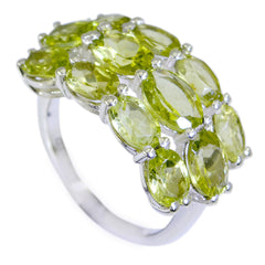Camila green gemstone cocktail ring featuring multiple oval green gemstones set in silver band