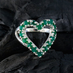 Luna green gemstone heart ring with silver band on dark textured background