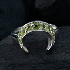 Rina silver crescent shaped green gemstone ring with multiple round green gemstones