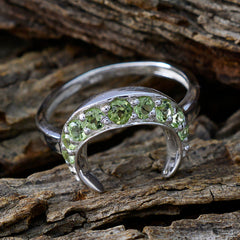 Rina green gemstone ring featuring multiple round green stones set in silver crescent design