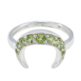Rina green gemstone ring featuring multiple round green stones set in a silver crescent design
