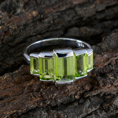 Eva polished silver ring with three emerald cut peridot stones, elegant green gemstone ring for women