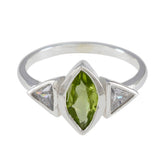 Putri green gemstone ring for women with marquise cut green center stone and two triangular clear stones