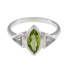 Putri green gemstone ring for women with marquise cut green center stone and two triangular clear stones