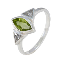 Putri silver ring featuring a marquise green gemstone and two triangle clear stones green gemstone ring for women