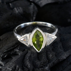 Putri green gemstone ring for women with marquise-cut green stone and two clear triangular side stones