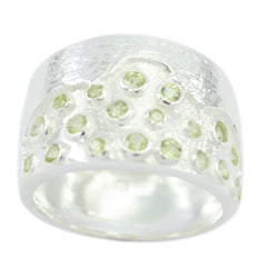 Angel silver ring featuring multiple small green gemstones in a green gemstone signet ring design