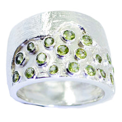 Angel green gemstone signet ring with multiple small green stones set in textured silver band