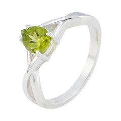 Li Lee green gemstone solitaire ring with a heart-shaped green stone set on a silver band