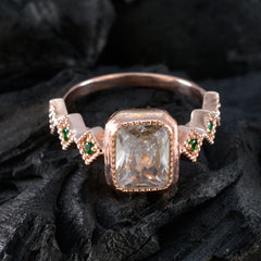 Hannah green gemstone statement ring with large central gem and smaller green stones on a rose gold band