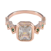 Hannah rose gold ring with clear center stone and small green gemstones green gemstone statement ring