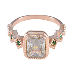 Hannah rose gold ring with clear center stone and small green gemstones green gemstone statement ring