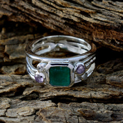 Hannah sterling silver ring with square green center stone and small purple accents on wood green gemstone statement ring