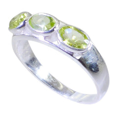 Riya silver ring with three green gemstones featuring a green gemstone trilogy ring design