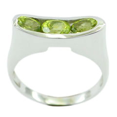 Valentina green gemstone trilogy ring with three oval green gemstones set in silver band