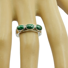 Leah green gemstone trilogy ring with three oval green stones on silver band