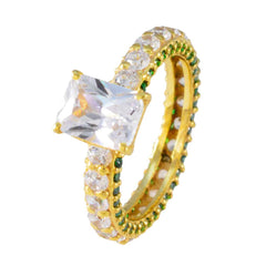 Teresa gold ring with large clear stone and green halo engagement ring detailing