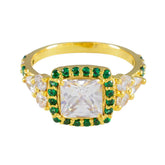Chen gold ring with green halo engagement ring design featuring square center stone and emerald accents