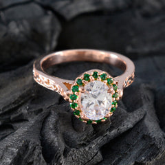Putri green halo gemstone ring with clear oval center stone and intricate rose gold band design