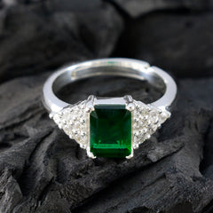 Sarah green halo ring for women with emerald green center stone and diamond accents on silver band