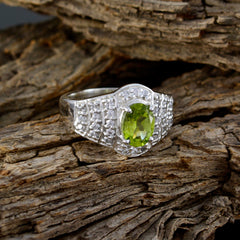 Isadora green halo ring for women with oval peridot center and pave cubic zirconia on sterling silver band