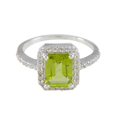 Skylar green halo ring for women with emerald cut green gemstone and diamond accents