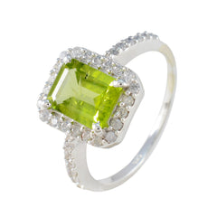 Skylar green halo ring for women with rectangular green gemstone and surrounding clear stones