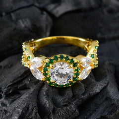 Hina green halo ring for women with gold band and clear and green gemstones on black background