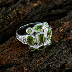 Lourdes green navratna ring sterling silver band with multiple faceted peridot gemstones on bark