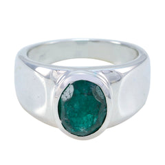 Antonia green solitaire ring with large emerald oval gemstone set in polished silver band