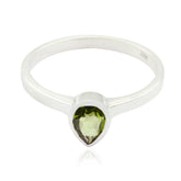 Olivia green solitaire ring with teardrop shaped gemstone and silver band