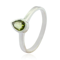 Olivia green solitaire ring with pear-shaped green gemstone set on a sleek silver band