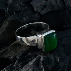Maria green solitaire ring with square green cabochon set in polished sterling silver band on dark background
