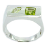 Lourdes green toi et moi ring with two green gemstones set in a modern silver band