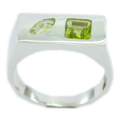 Lourdes green toi et moi ring with two green gemstones set in a modern silver band