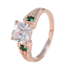 Jia green trilogy ring for women with rose gold band and clear center stone with green side gemstones