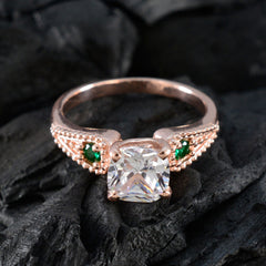 Jia green trilogy ring for women with rose gold band and sparkling green gemstones