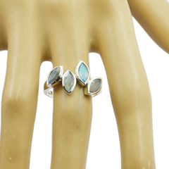 Noelia silver grey gemstone statement ring with four marquise labradorite stones on finger