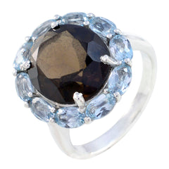 Hannah abstract multicolor gemstone ring featuring a dark central stone surrounded by light blue gemstones