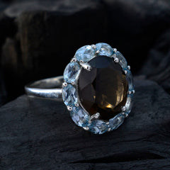 Hannah abstract multicolor gemstone ring with a large dark center stone surrounded by light blue gemstones