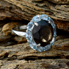 Hannah abstract multicolor gemstone ring with large dark center stone and light blue surrounding gems