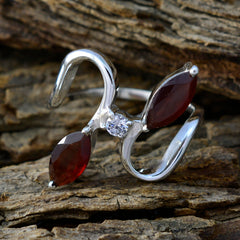 Lili abstract red gemstone ring with dual marquise red stones and central clear gem on silver band