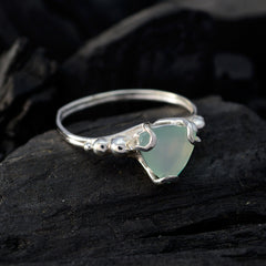 Eliza aqua solitaire gemstone ring with silver band and triangular aqua stone on dark textured background