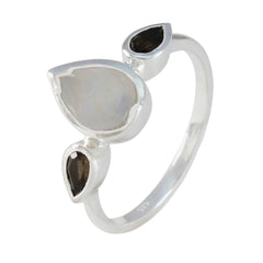Kristine silver artisan trilogy ring with pear shaped moonstone center and two smoky quartz accents