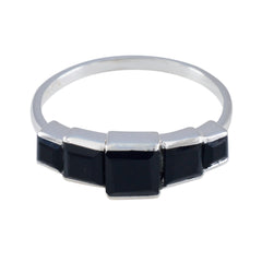 Audrey black gemstone statement ring with five square black stones set on a silver band