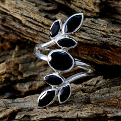 Lucy black leaf ring for women with silver band and black stone leaf design on rustic wood