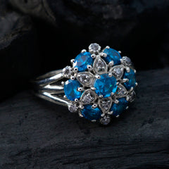 Nisa blue gemstone statement ring with multiple bright blue stones set in silver band